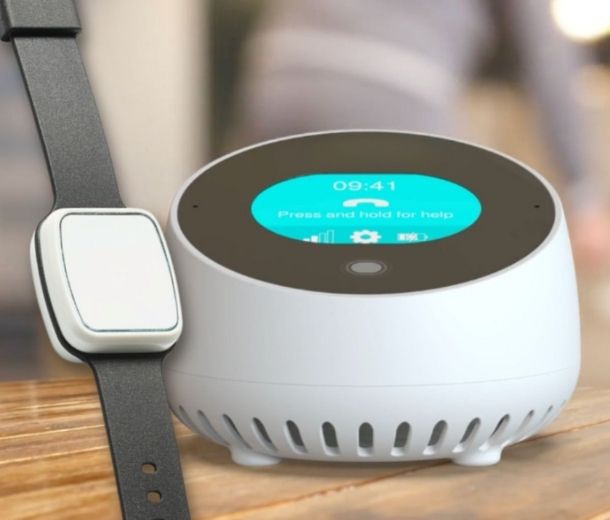 HelpAlert Home Lifeline base unit with wrist alarm button on table